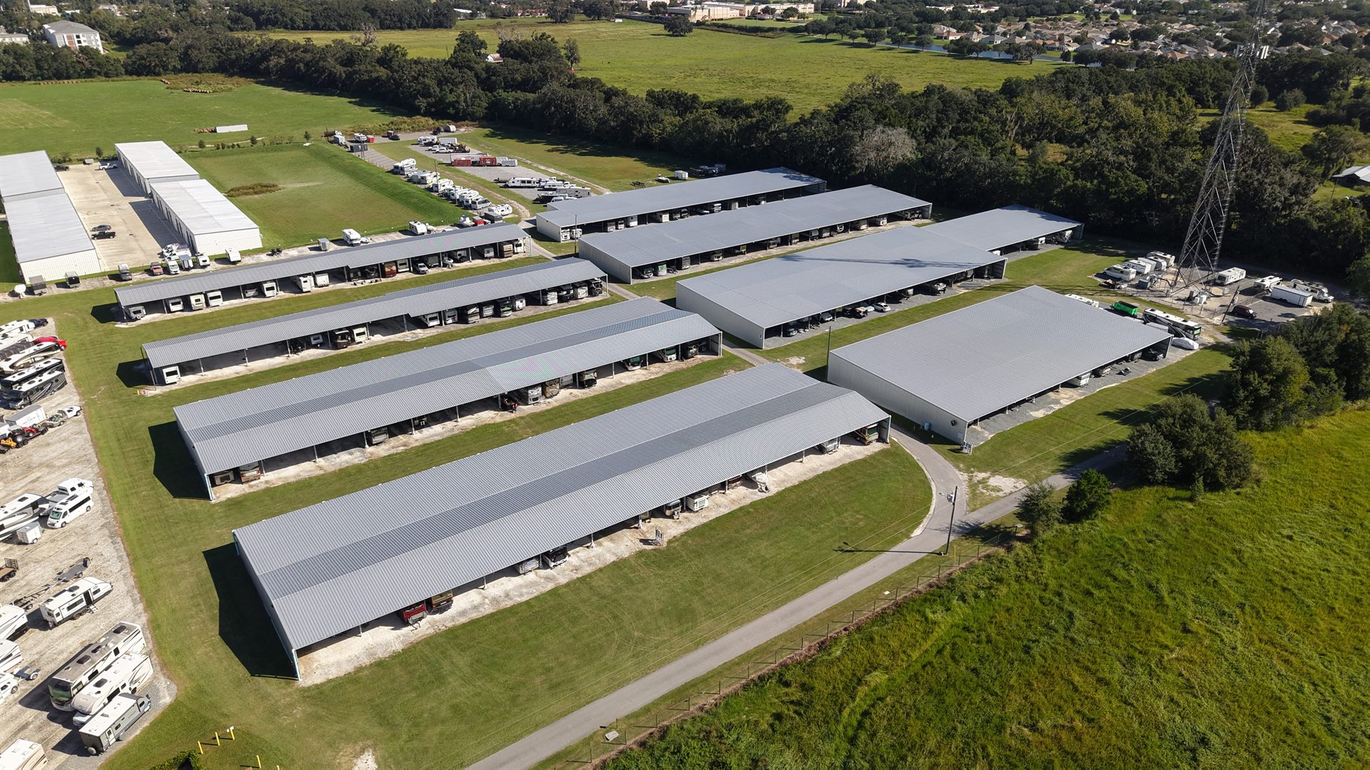Drone photo showing rows of drive-up self storage units and the facility unit mix from above
